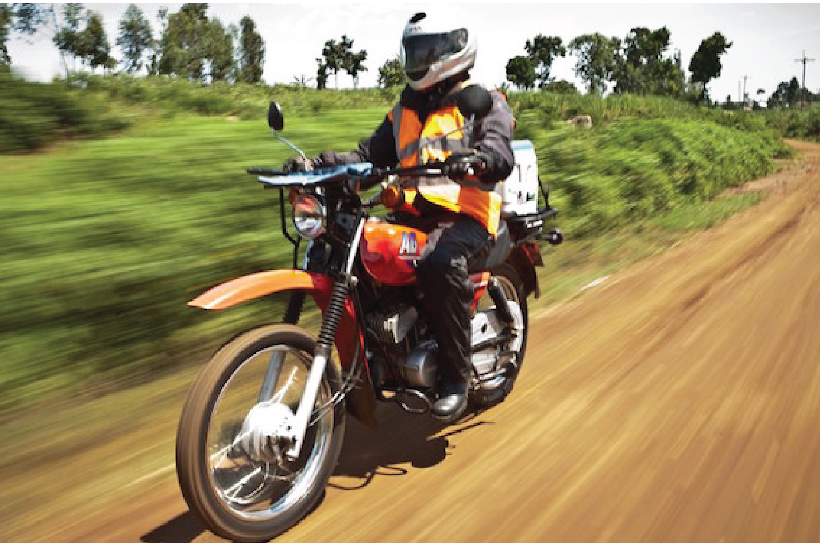 Riders for Health health worker on motorcycle
